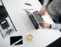A business professional customizes a business proposal on a laptop